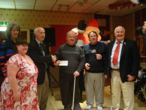 President Martin Love and Community and Vocation Chairman Clive Howells present a cheque to Abergavenny Gateway Club